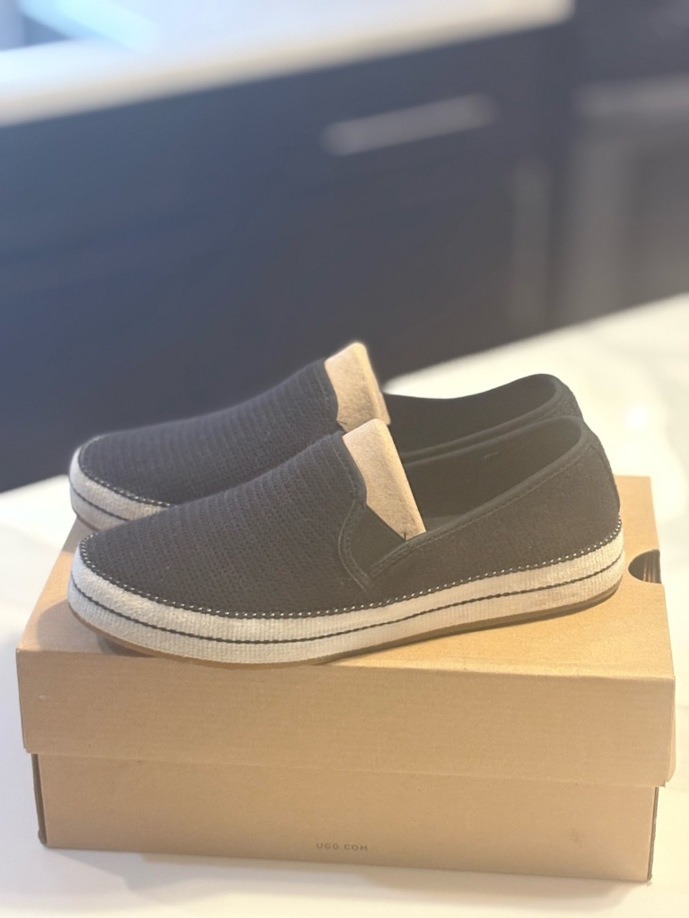UGG Black Slip-On Casual Flats with White Trim